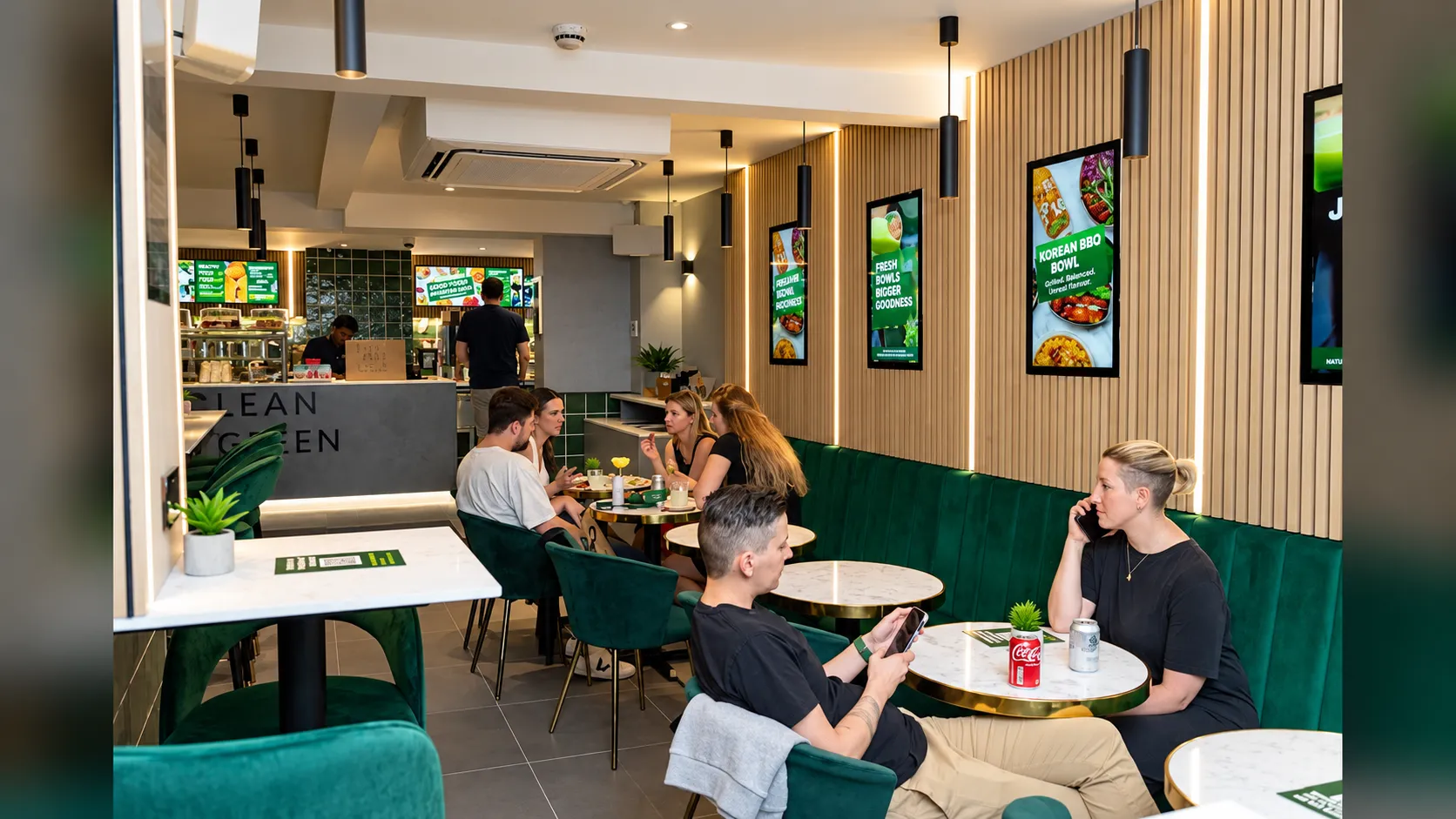 Digital advertising screen outside a UK restaurant